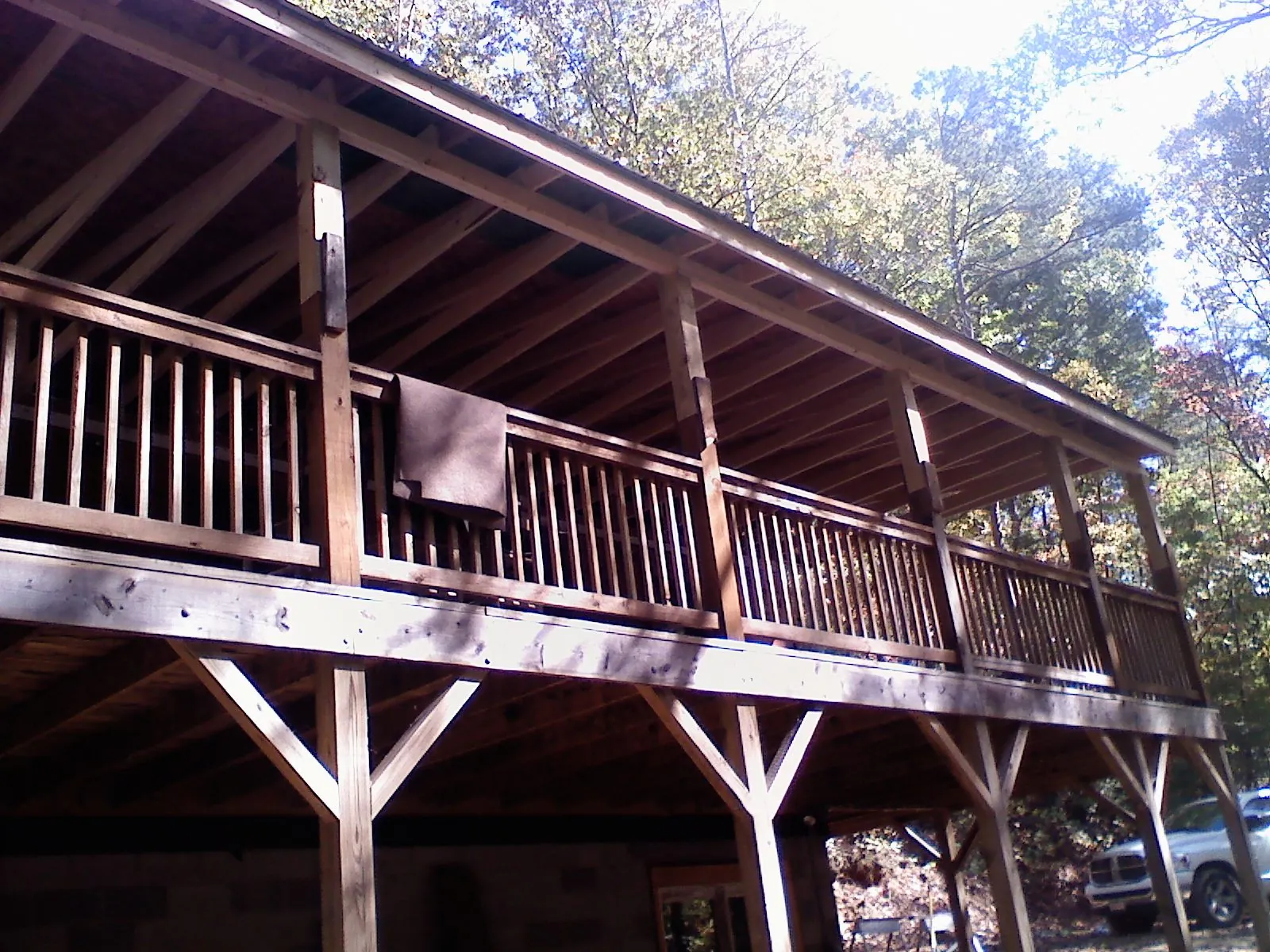Timber framing under a new elevated porch and deck — Roof Leak Repair in Onset by Roofing Brothers